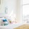 Pet-Friendly Apartments In The Gulch, Nashville, TN - 1200 Broadway - Bedroom With Bed, Nightstands With Lamps, And Floor To Ceiling Windows.