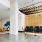 Spacious and well lit lobby with plenty of seating and large windows with a view of the city 