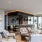 Spacious and well lit lounge area with seating and large floor to ceiling windows with a city view 